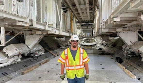 engineering major stands in front of HRBT project