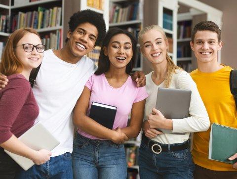 Group of students studying in library at university